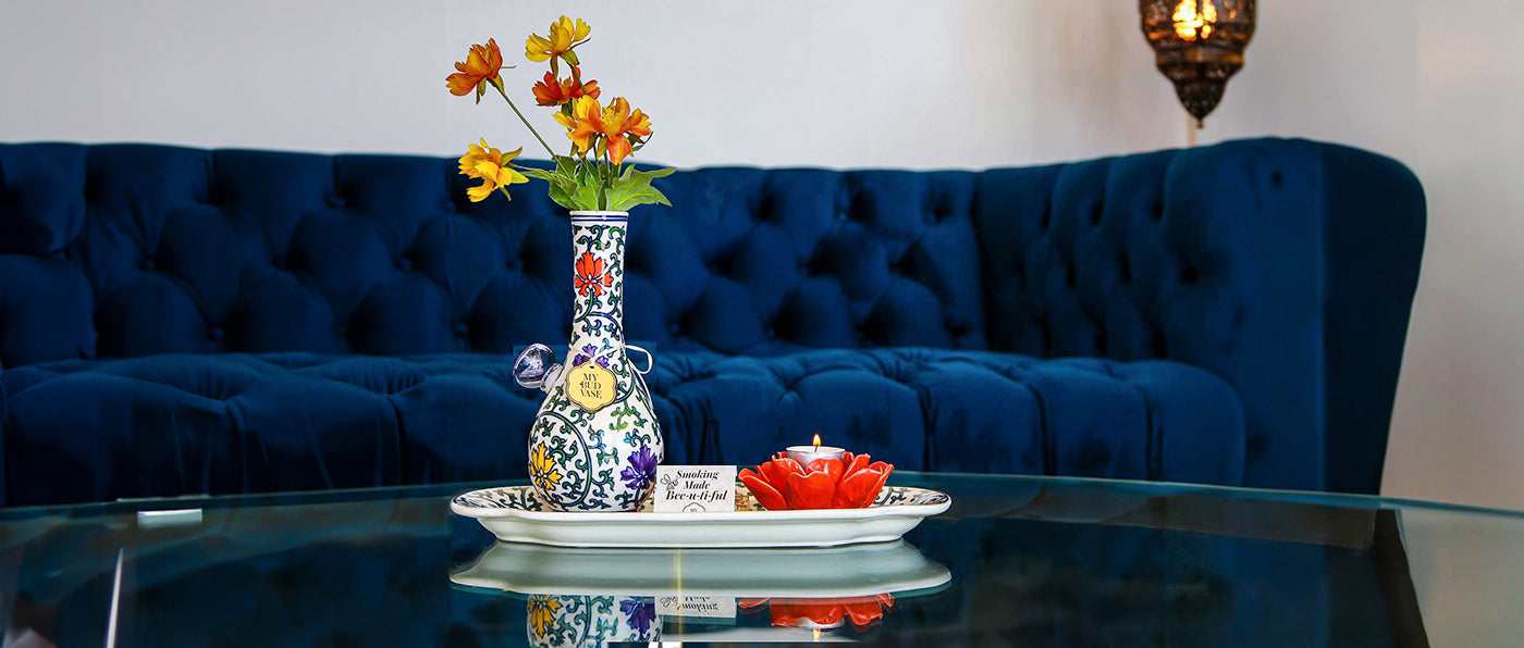 My Bud Vase on glass coffee table in front of hip blue couch